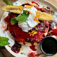 Red Pancakes with side of maple syrupp  at Brunchit in Malaga