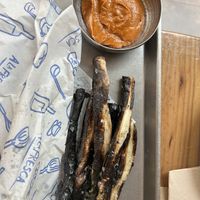 Starter which was fried onions and spicy sauce  at A la Fresca in Denia