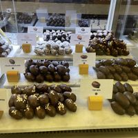 V stands for vegan. All the dates chocolate doesn’t contain milk and it is vegan   at Mirzam Chocolate Makers in Dubai