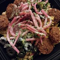 rice, chickpeas, black olives, sliced beets, pickled turnips, parsley, falafel and tahini at Pita or Bowl in Springfield