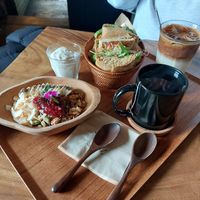 Soy yogurt bowl to the left. (Non vegan meal to the right) at The Royal Food & Drink in Seoul