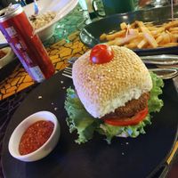 Chickpea burger, fungi risotto and French potatoes  at Na Mata Café in Belem