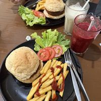 Vegan meat-free burgers and fries with smoothies.  at Veggie Tales x Wagging Tales Cafe in Hua Hin