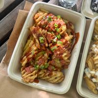 bacon green onion and bbq sauce on top at Mavericks Burger Co in Toronto