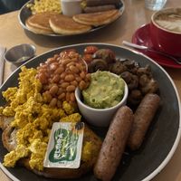 Vegan LD breakfast and vegan scrambled tofu pancakes with vegan sausages wand maple syrup   at Laughing Dog in Worthing