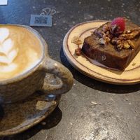 Almond latte and vegan banana bread at Honest Greens - Velázquez in Madrid