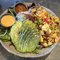 Delicious avocado supergreen bowl with tempeh  at Honest Greens - Velázquez in Madrid