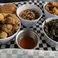 Southern Sides: Black-eyed peas, yams, collard greens, and fried okra.  at the hive vegan eatery in Houston