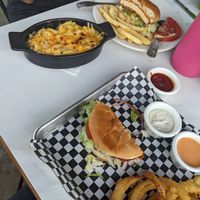 Buffalo Chikin Sandwich w/ onion rings and fries at the hive vegan eatery in Houston