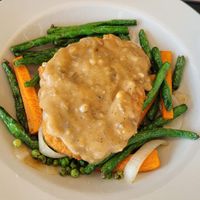The Hive Bowl - Gardeins over mashed potatoes with mushroom gravy and veggies at the hive vegan eatery in Houston