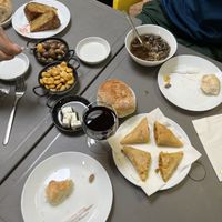 A selection of foods to start - mushroom soup, vegan feta, chickpea flour tortilla, marinated olives & lupin beans and samosas   at Lupin Snack Bar in Porto