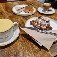 Turmeric latte and cortado with oat milk. Almond croissant and pain au chocolat. at Fika+ in Chester