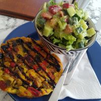 Quiche with salad for lunch at Café Rotkehlchen - Merowingerstraße in Cologne