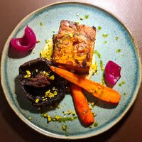 Portobello mushroom, glazed carrots, layered pumpkin entree. at Go Green The Restaurant in Luanda