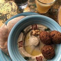 Hummus and falafels, fresh orange juice  at KAFKA Hummus Café  in Prague