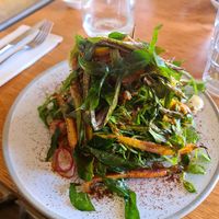 Root vegetables, greens on toast at Common Galaxia in Seddon