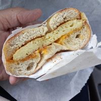 Ëgg & chëëse sando on a plain vegan bagel at Ben & Esther's Vegan Jewish Deli in San Diego