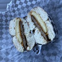 Egg, cheese and sausage on onion bagel   at Ben & Esther's Vegan Jewish Deli in San Diego
