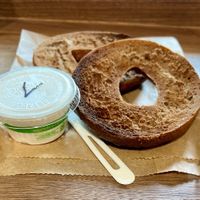 Pumpernickel bagel with vegan cream cheese   at Flying Goat Coffee in Healdsburg