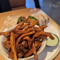 Buffalo wrap with sweet potato fries and jalapeño aioli  at Fresh Sherway in Toronto