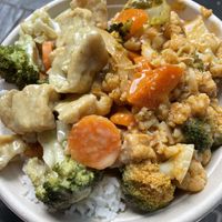 Mix of red and green curries on rice  at Vegan Thai Food - Food Stall in North West London