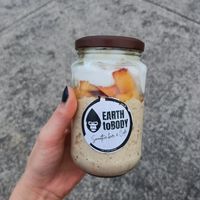 Peach and granola protein oat jar at Earth to Body Cafe in Croydon