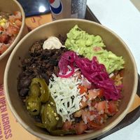 Build your own bowl with vegan cheese and Impossible meat at Taqado - Dubai Mall in Dubai