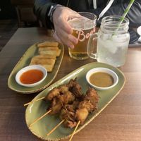 Satay chicken skewers and spring rolls   at Vegan Planet in North West London