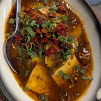 Sliced vegan fish in sizzling chilli oil at Vegan Planet in North West London