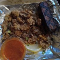 Fried oyster mushrooms,  Buffalo sauce, and grilled tofu. at Fiction Kitchen in Raleigh