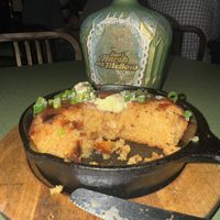 Cast Iron Skillet Cornbread with Hickory Syrup Drizzle & Vegan Butter  at Fiction Kitchen in Raleigh