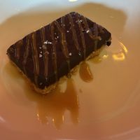 Chocolate truffle bar with almond crust and caramel sauce.   at Fiction Kitchen in Raleigh