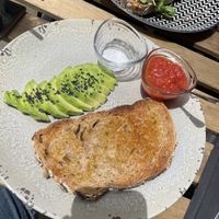Toast with tomato - extra avocado   at Cult Café in Valencia