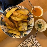 Baked potatoes with sauce at A Corre Vexeta in Santiago De Compostela