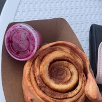 Cinnamon roll with pink pitaya frosting   at Brazilian Fun Foods - Maybe closed in Tampa