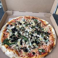 Vegan pizza with olives, spinach artichoke   at Tony's Pizza in Flagler Beach