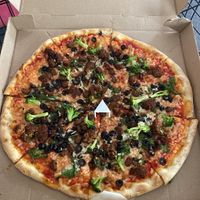 Vegan pizza with cheese, meatballs, sausage, black olives, spinach and broccoli.  at Tony's Pizza in Flagler Beach