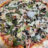 Yum! Great crust, good sauce and fresh veggies with vegan cheese and veggie sausage options .  at Tony's Pizza in Flagler Beach