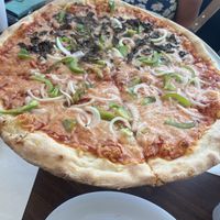 Vegan mozzarella with pepper, onions and mushrooms on half!   at Tony's Pizza in Flagler Beach