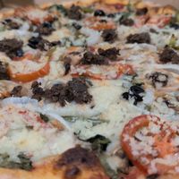 Medium happy vegan - now with vegan meatball on top at Tony's Pizza in Flagler Beach