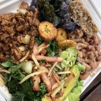 All of the sides are vegan.  Rice and peas fill the side of the container with the soy curls.  at Rasta in Nassau