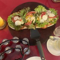 Vegan pizza and tambourine I was given to accompany the live music!   at Herbolarium in Santa Fe
