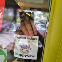 Gave the a Happy Cow decal, which they immediately put up! at Pura Vida Vegan Tacos in Antwerpen