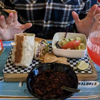 Burrito, salad and tequila sunrise at Pura Vida Vegan Tacos in Antwerpen