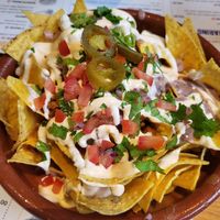 Loaded nachos for two 😋 at Pura Vida Vegan Tacos in Antwerpen