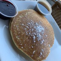 Pancake with fruit syrup  at Sunnyside Breakfast Lounge in Mesa