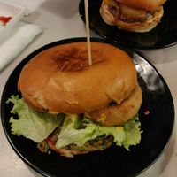 Quinoa burger + onion rings at nube in Spilamberto