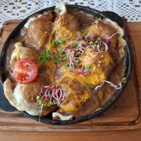 Oven backed pierogi with vegan cheese at Pod Przykrywką in Wroclaw