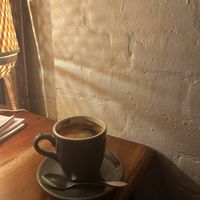 Black coffee  at Cinnamon & Co in West End