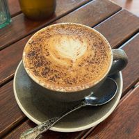 Cappuccino with oat milk  at Cinnamon & Co in West End